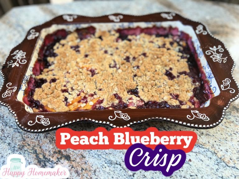 Peach Blueberry Crisp in a 9x13 brown casserole dish