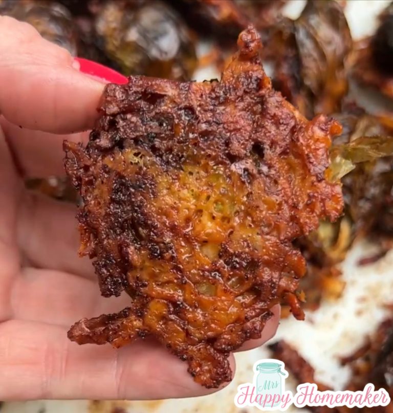 Parmesan crusted Brussels sprout being held by a hand