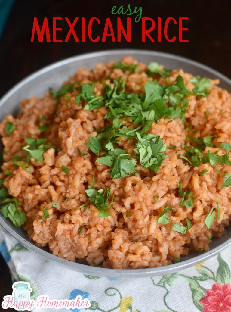 Mexican Rice with chopped cilantro garnish in a round silver bowl