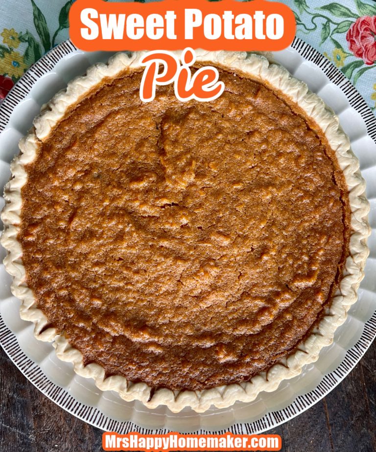 Sweet Potato Pie in a white dish with a blue floral towel next to it